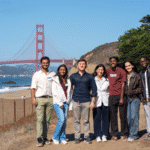Students pose in front of the Golden Gate Bridge